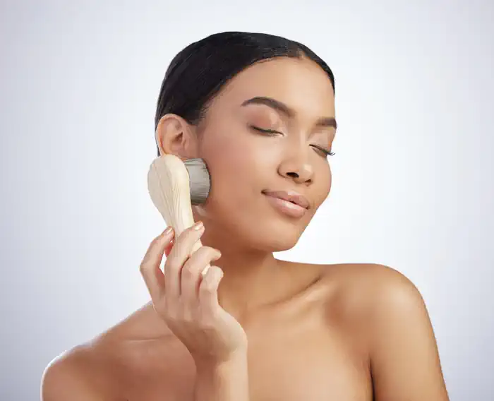 Woman Exfoliating Skin