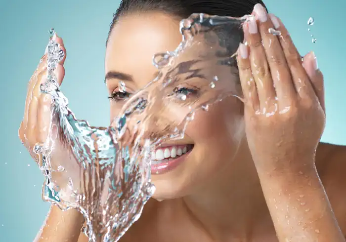 Woman Washing Her Face After Exercising